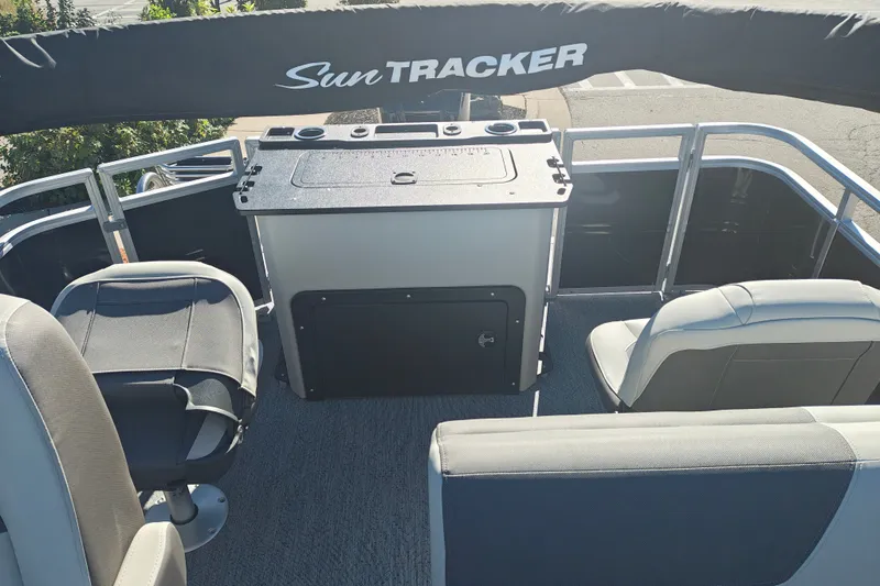 Slide: The Image of 2027 Sun Tracker Fishin' Barge 20 DLX interior with seating and storage. - 37