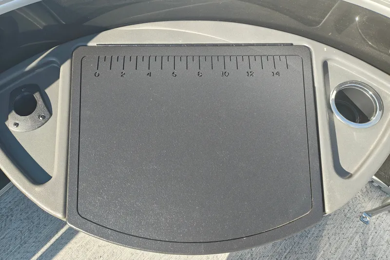 Slide: The Image of 2027 Sun Tracker Fishin' Barge 20 DLX fishing station with ruler and cup holder. - 59