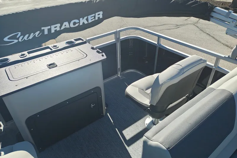 Slide: The Image of 2027 Sun Tracker Fishin' Barge 20 DLX interior with seating and storage features. - 38
