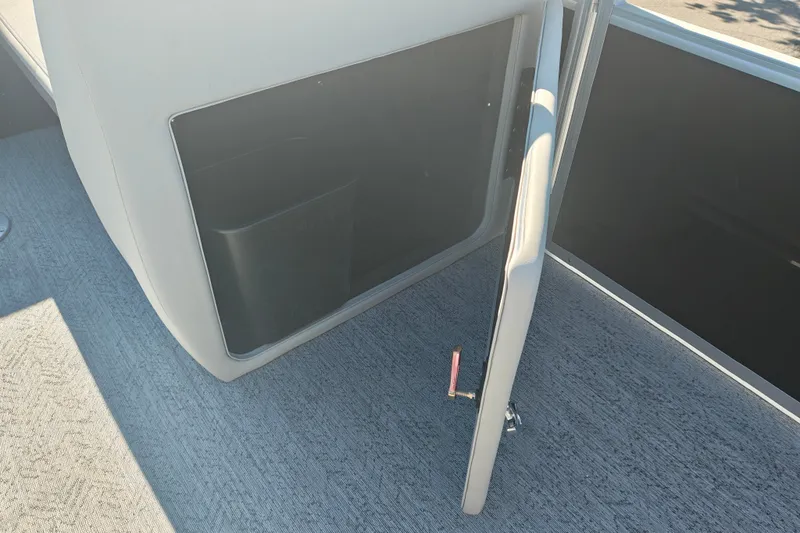 Slide: The Image of Open storage compartment on 2027 Sun Tracker Fishin' Barge 20 DLX boat. - 22