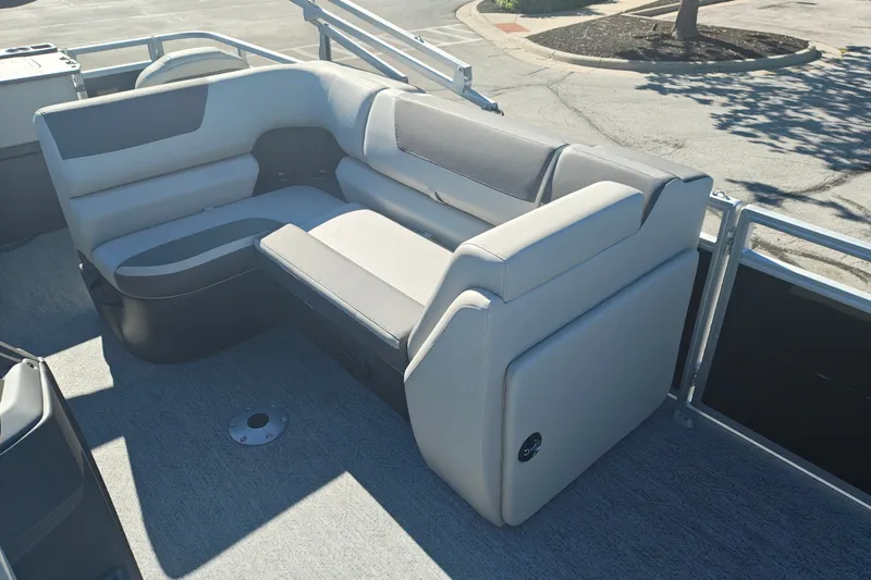 Slide: The Image of Sun Tracker Fishin' Barge 20 DLX 2027 interior seating, featuring comfortable gray upholstery. - 20