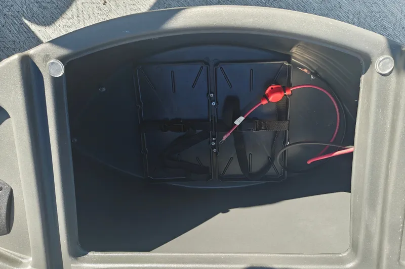 Slide: The Image of Battery compartment of 2027 Sun Tracker Fishin' Barge 20 DLX with red wiring. - 57