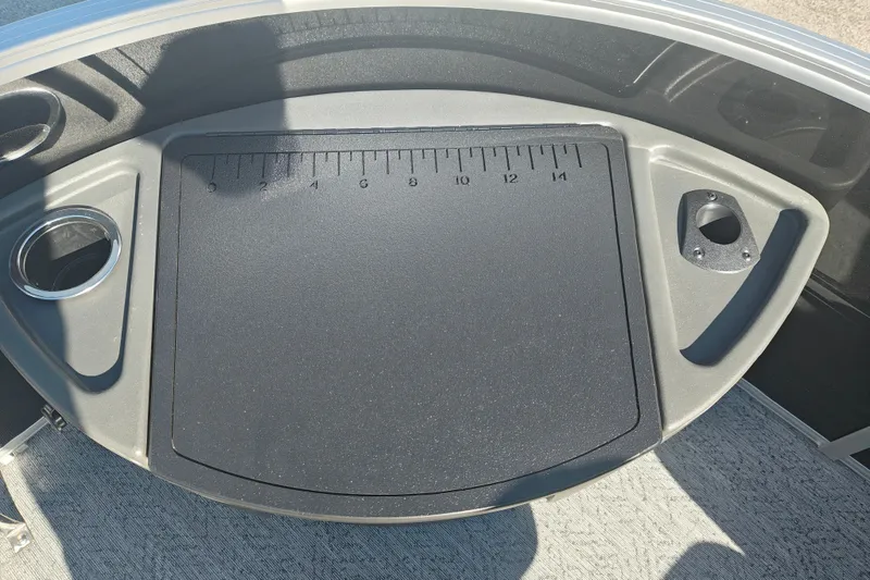 Slide: The Image of Sun Tracker Fishin' Barge 20 DLX 2027, featuring a measuring board and cup holder. - 56