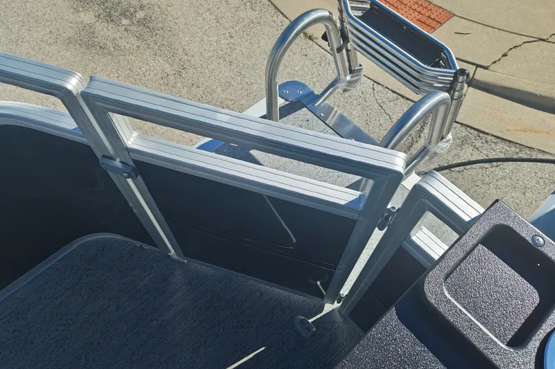 Slide: The Image of 2027 Sun Tracker Fishin' Barge 20 DLX boat ladder and deck detail. - 44