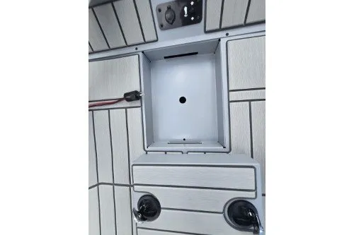 Slide: The Image of 2027 Tracker Bass Tracker 175 CC boat interior with storage compartment and cup holders. - 14