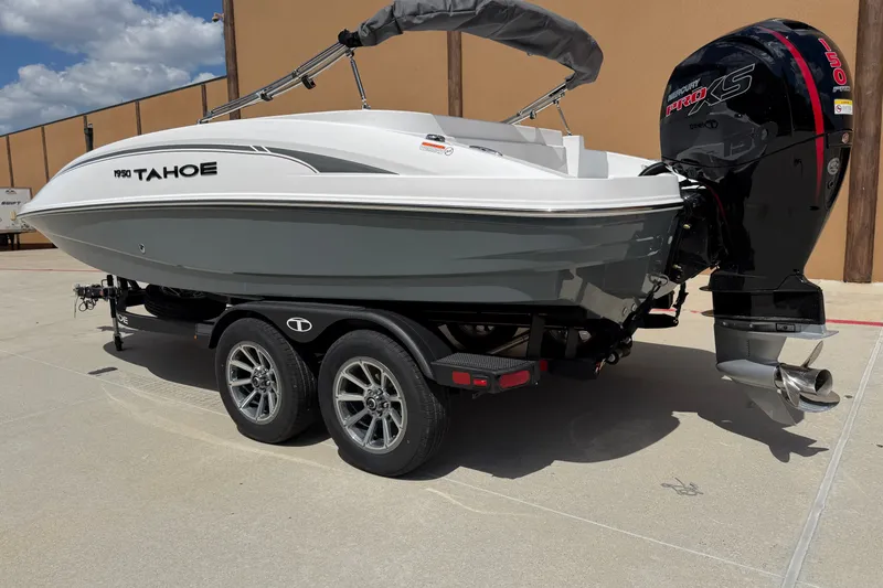 Slide: The Image of 2027 Tahoe 1950 boat on trailer with Mercury Pro XS outboard motor. - 2