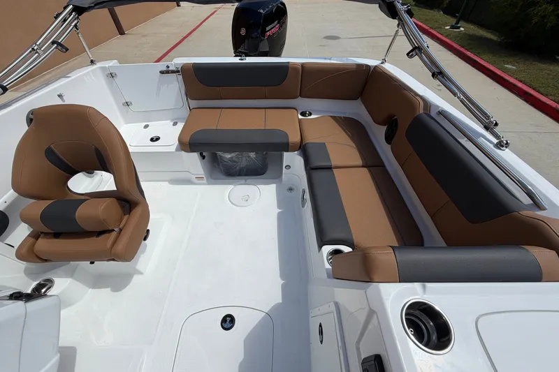 Slide: The Image of Luxurious interior of 2027 Tahoe 1950 boat with brown and black seating. - 85