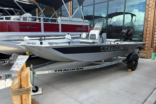 The Image of 2027 Tracker Bass Tracker Classic CC boat on trailer, displayed outdoors. - 0