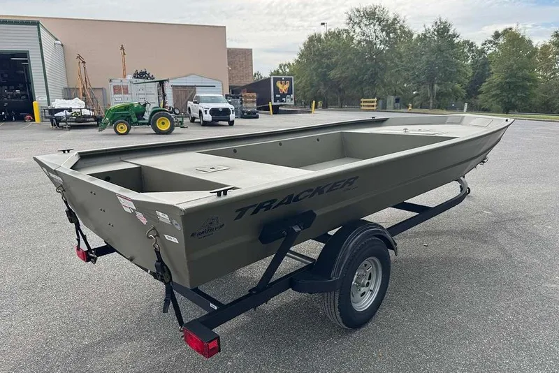 The Image of 2027 Tracker Grizzly 1754 Utility boat on trailer in outdoor setting. - 0