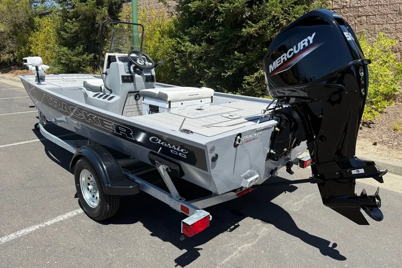 The Image of 2027 Tracker Bass Tracker Classic CC boat with Mercury engine, parked outdoors. - 0