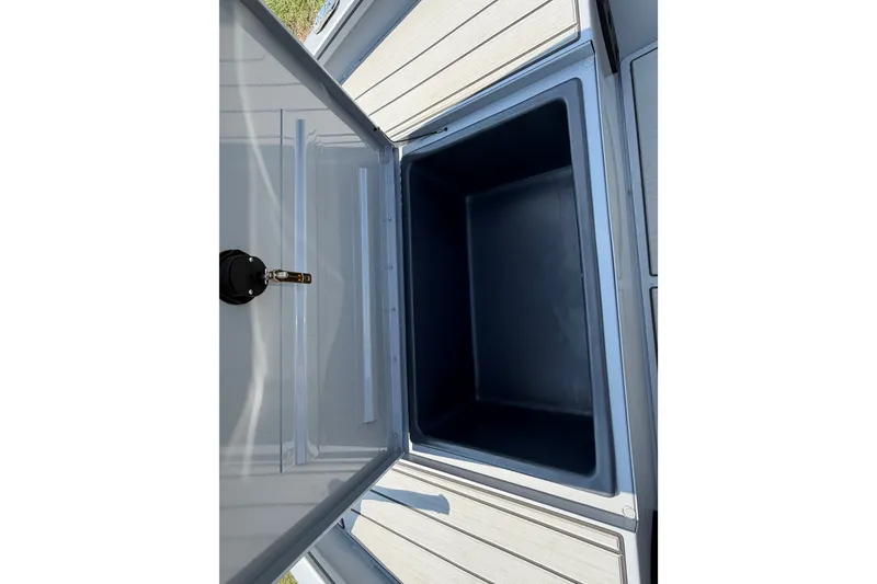 Slide: The Image of Open storage compartment on 2027 Tracker Bass Tracker 175 CC boat. - 44