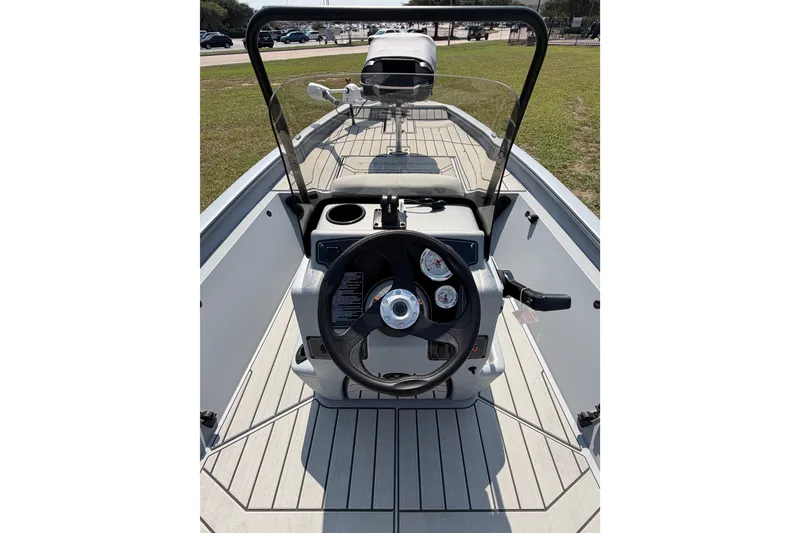 Slide: The Image of 2027 Tracker Bass Tracker 175 CC boat interior with steering wheel and dashboard controls. - 50