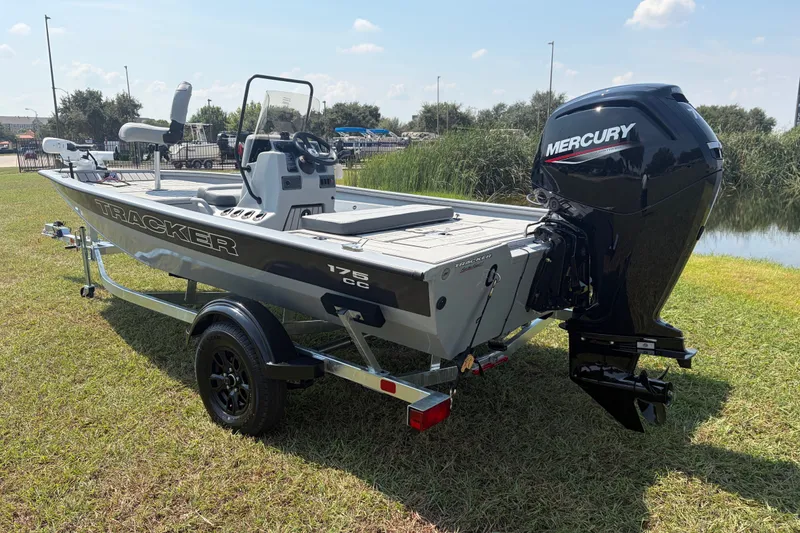Slide: The Image of 2027 Tracker Bass Tracker 175 CC boat with Mercury engine on grassy area. - 36
