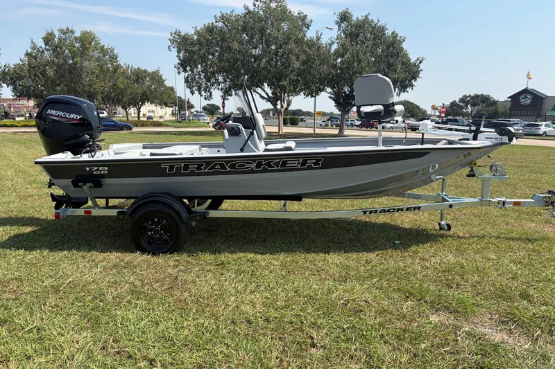 Slide: The Image of 2027 Tracker Bass Tracker 175 CC boat on trailer, parked on grass. - 39