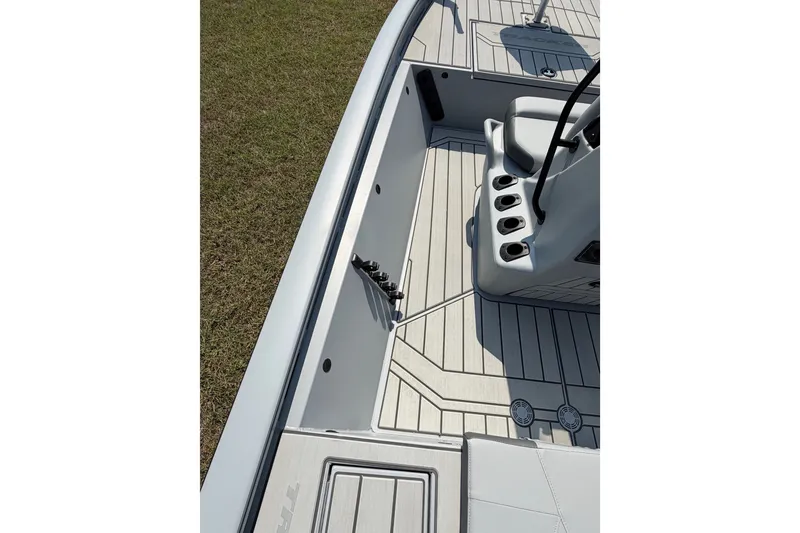 Slide: The Image of 2027 Tracker Bass Tracker 175 CC boat interior with sleek seating and rod holders. - 43