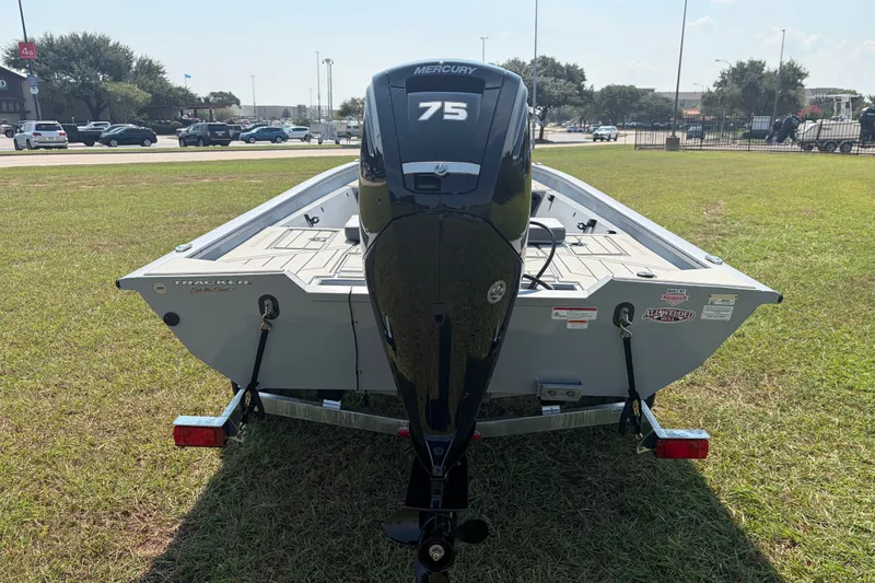 Slide: The Image of 2027 Tracker Bass Tracker 175 CC boat with Mercury 75 engine on grassy field. - 37