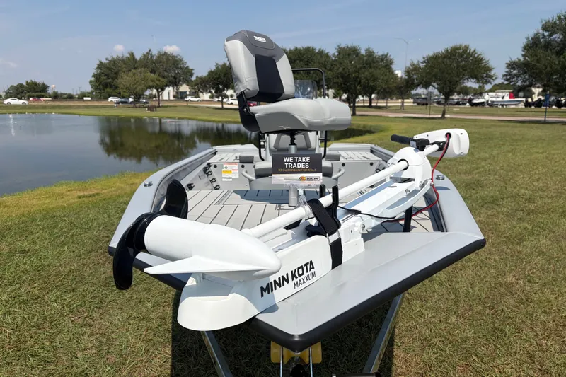 Slide: The Image of 2027 Tracker Bass Tracker 175 CC boat with Minn Kota Maxxum motor by a lake. - 33