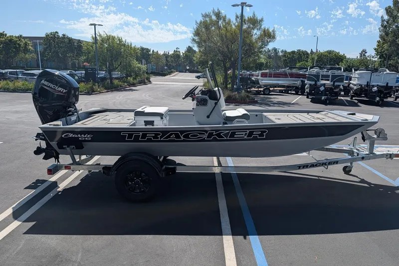 The Image of 2027 Tracker Bass Tracker Classic CC boat on trailer in parking lot. - 0