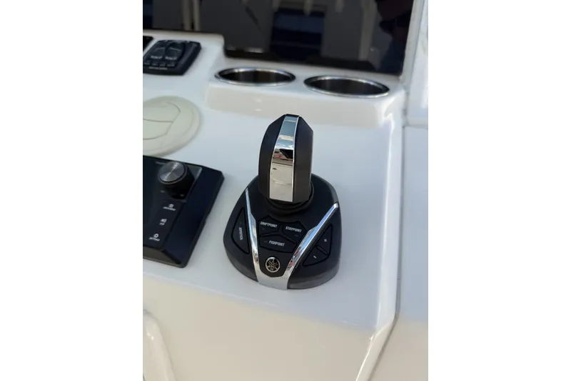 Slide: The Image of Joystick control on 2024 Cobia 350 Center Console boat dashboard. - 27