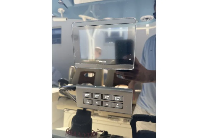 Slide: The Image of 2024 Cobia 350 Center Console dashboard with Yamaha display and control panel. - 25