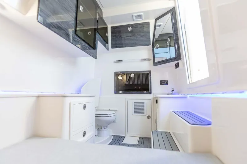 Slide: The Image of Manufacturer Provided Image: 2024 Cobia 350 Center Console interior cabin with modern amenities and sleek design. - 41