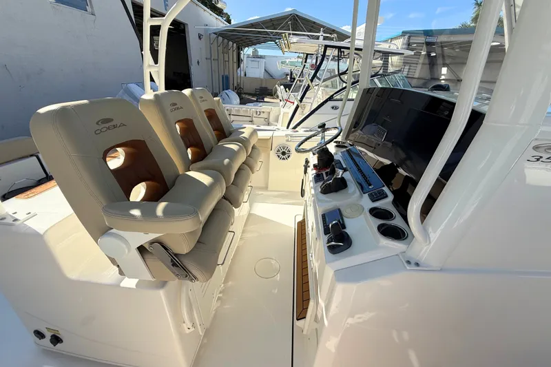 Slide: The Image of 2024 Cobia 350 Center Console boat interior with helm and seating area. - 21