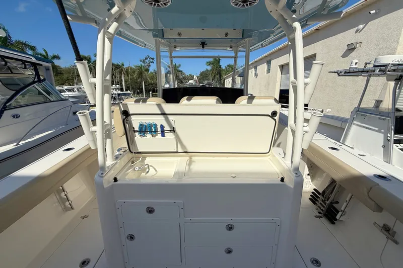 Slide: The Image of 2024 Cobia 350 Center Console boat interior with seating and storage compartments. - 18