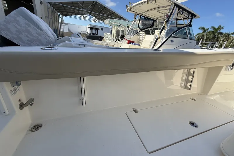 Slide: The Image of 2024 Cobia 350 Center Console boat interior with seating and storage compartments. - 43