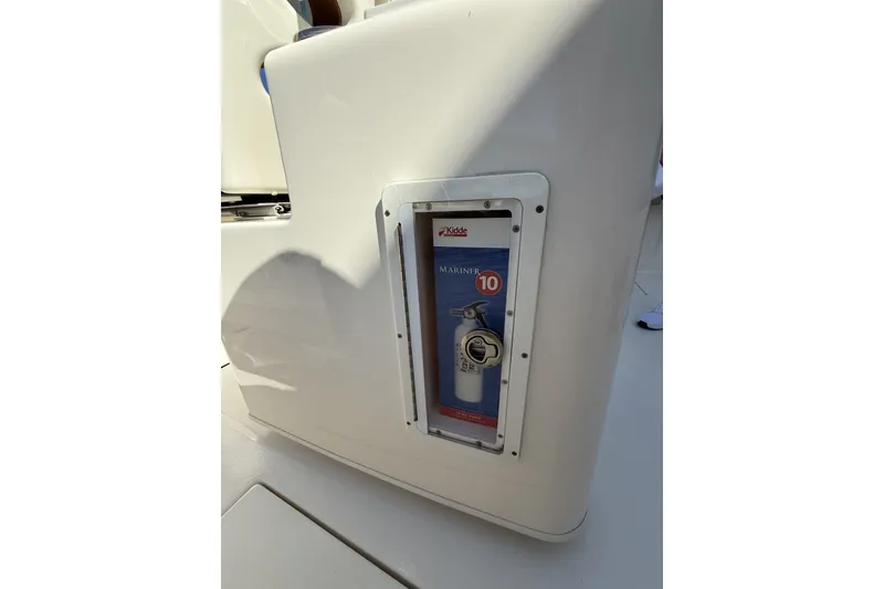 Slide: The Image of 2024 Cobia 350 Center Console with built-in fire extinguisher compartment. - 42