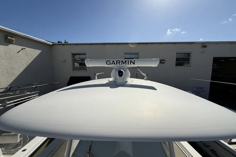 Slide: The Image of 2024 Cobia 350 Center Console boat with Garmin radar system on top. - 32
