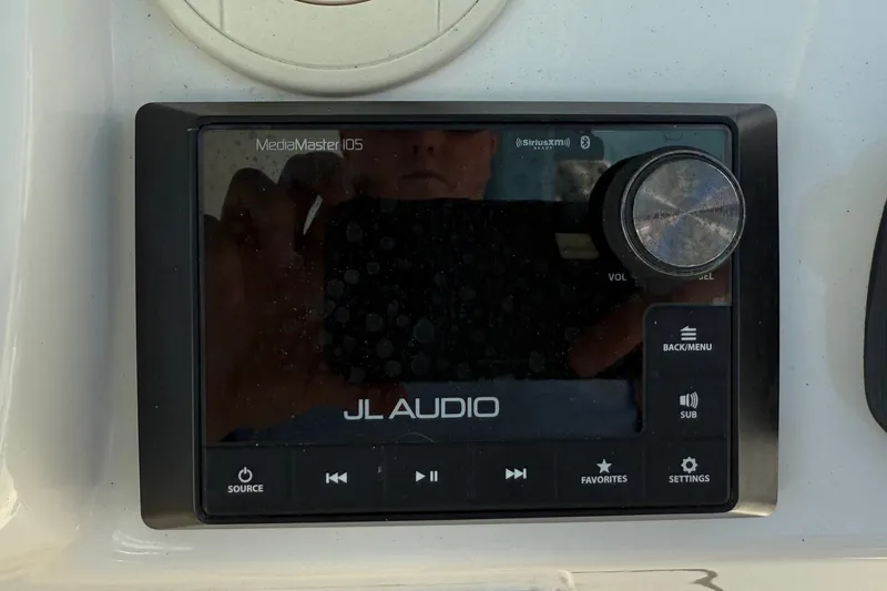 Slide: The Image of JL Audio MediaMaster 105 control panel on 2024 Cobia 350 Center Console boat. - 28