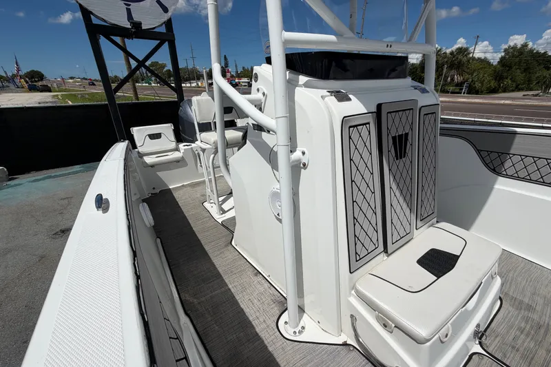 Slide: The Image of 2023 Wellcraft 202 Fisherman boat interior with seating and storage compartments. - 42