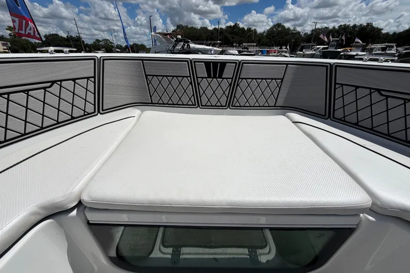 Slide: The Image of 2023 Wellcraft 202 Fisherman boat interior with cushioned seating and storage compartments. - 29