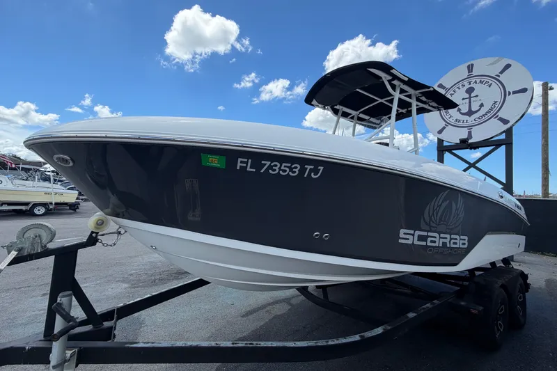 Slide: The Image of 2023 Wellcraft 202 Fisherman boat on trailer under blue sky. - 7
