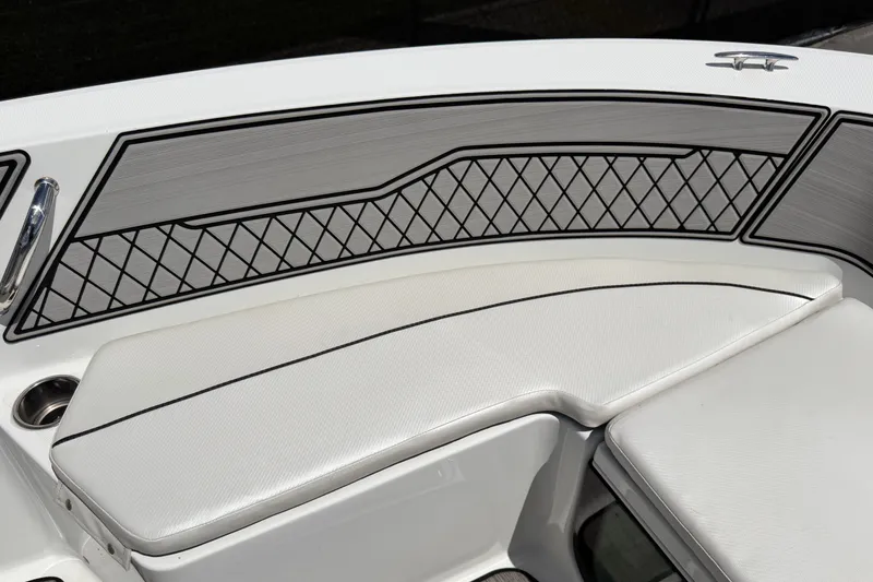 Slide: The Image of 2023 Wellcraft 202 Fisherman boat interior with cushioned seating and stylish panel design. - 28