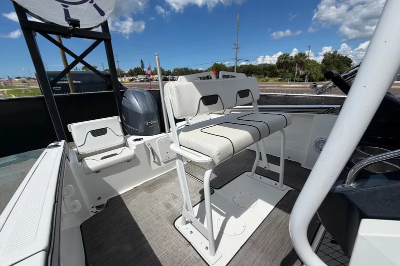 Slide: The Image of 2023 Wellcraft 202 Fisherman boat interior with seating and Yamaha 150 engine. - 43
