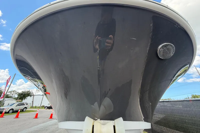 Slide: The Image of 2023 Wellcraft 202 Fisherman boat, close-up of the bow, outdoors on a sunny day. - 8