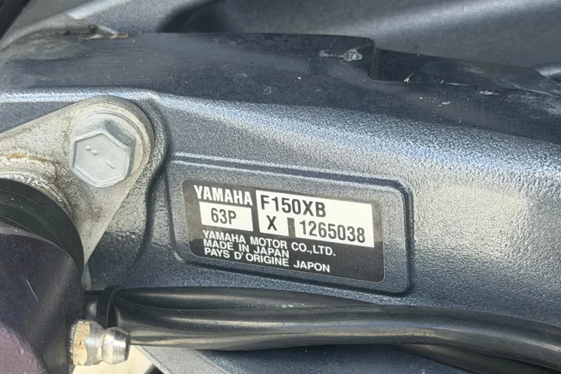 Slide: The Image of Close-up of Yamaha F150XB engine label on 2023 Wellcraft 202 Fisherman boat. - 56