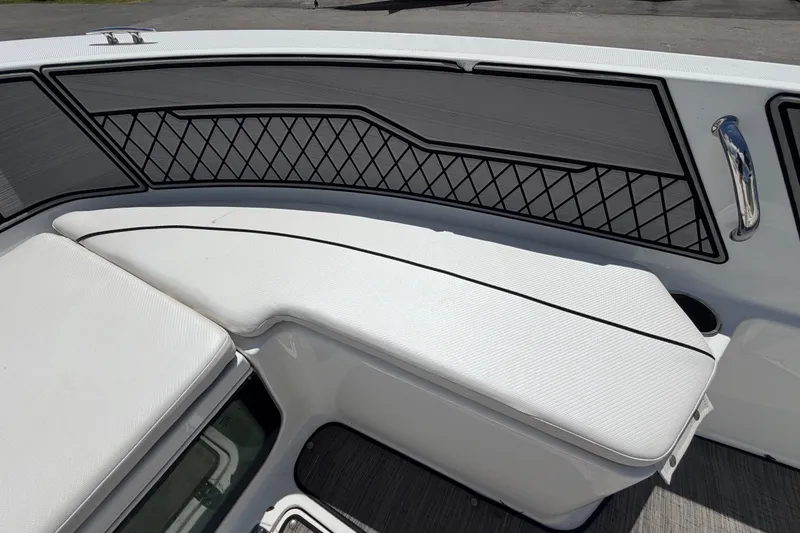 Slide: The Image of 2023 Wellcraft 202 Fisherman boat interior with cushioned seating and storage. - 35