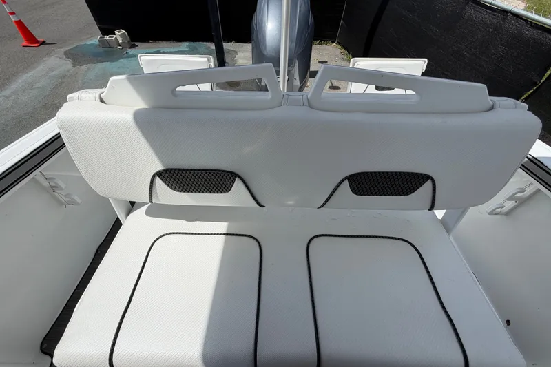 Slide: The Image of 2023 Wellcraft 202 Fisherman boat seat with white upholstery and black accents. - 44