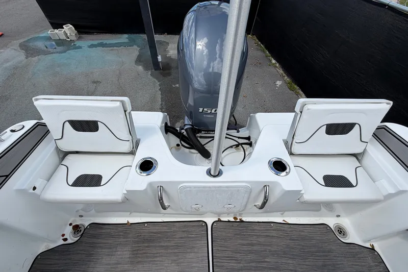 Slide: The Image of 2023 Wellcraft 202 Fisherman boat interior with seating and Yamaha 150 engine. - 45