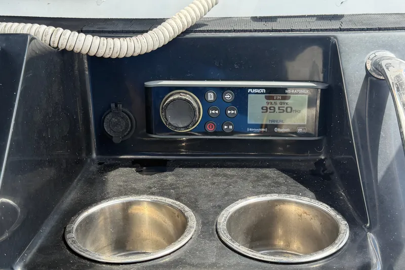 Slide: The Image of 2023 Wellcraft 202 Fisherman boat console with Fusion stereo and cup holders. - 21