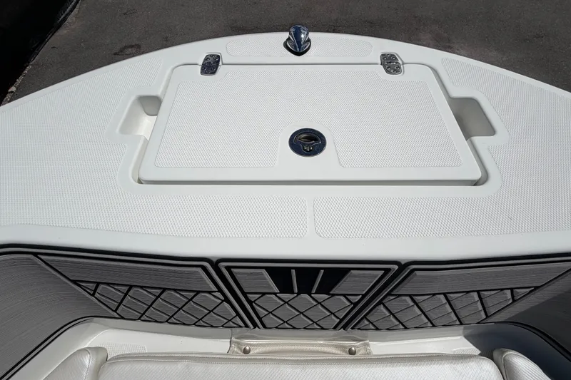 Slide: The Image of 2023 Wellcraft 202 Fisherman boat deck with storage compartment and sleek design. - 32