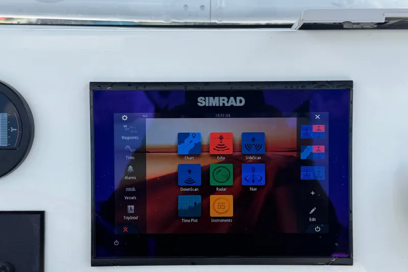 Slide: The Image of A Simrad screen on a boat displays navigation and sonar functions. - 19