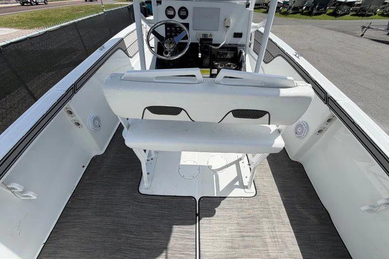 Slide: The Image of 2023 Wellcraft 202 Fisherman boat interior with steering console and seating. - 12