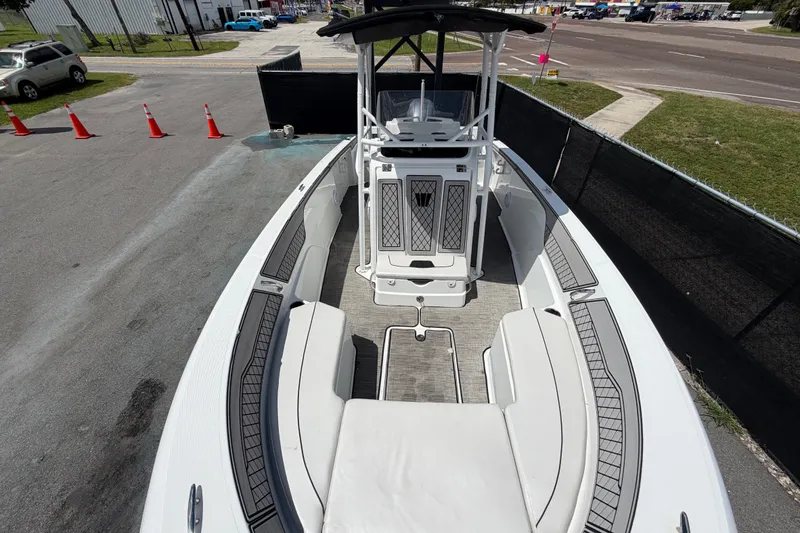 Slide: The Image of 2023 Wellcraft 202 Fisherman boat, interior view, parked on pavement with traffic cones nearby. - 36
