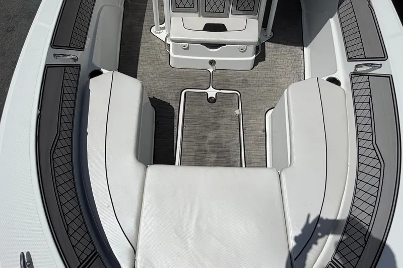Slide: The Image of Interior view of 2023 Wellcraft 202 Fisherman boat, featuring cushioned seating and non-slip flooring. - 37