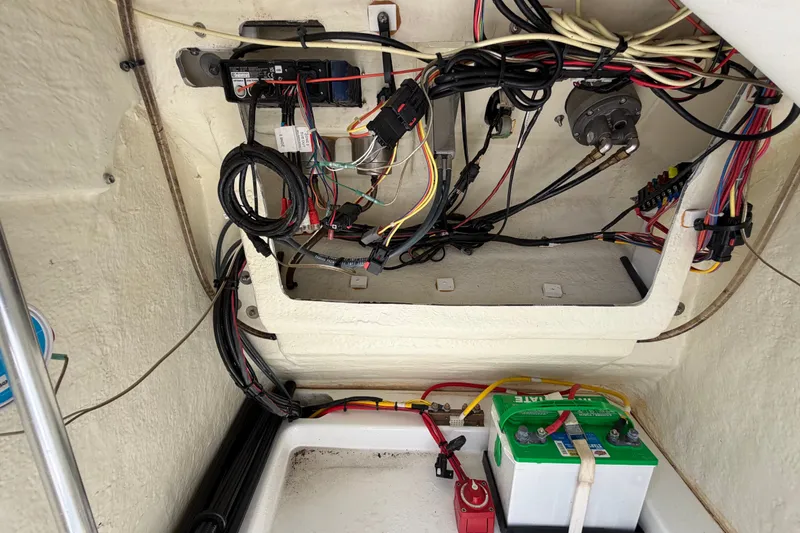 Slide: The Image of 2023 Wellcraft 202 Fisherman boat wiring and battery compartment, showcasing electrical setup. - 41