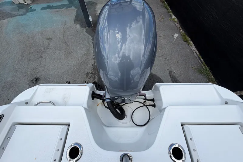 Slide: The Image of 2023 Wellcraft 202 Fisherman boat engine and deck view. - 53