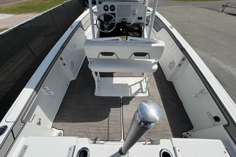 Slide: The Image of 2023 Wellcraft 202 Fisherman boat interior with steering console and seating. - 11